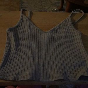 A gray crop top tank top